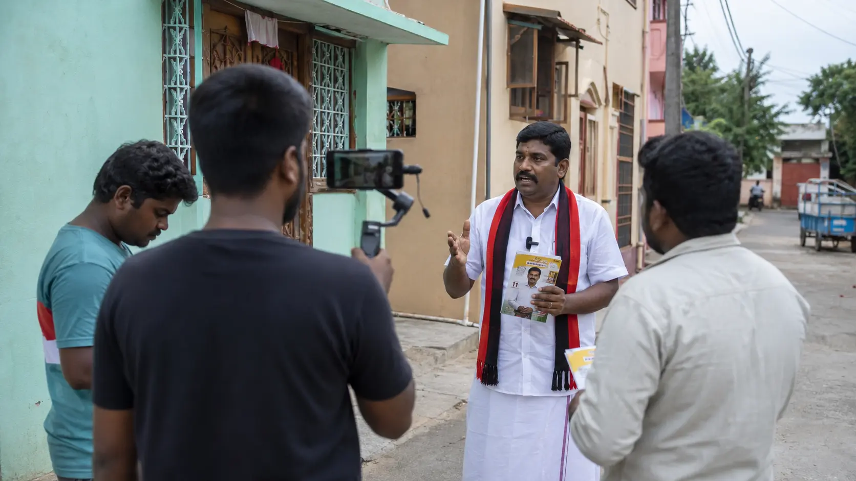 Digital campaign team recording short video content on a smartphone gimbal for a local body candidate